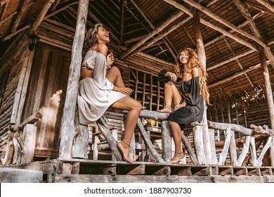 Two beautiful young stylish fashion models having fun outdoors  