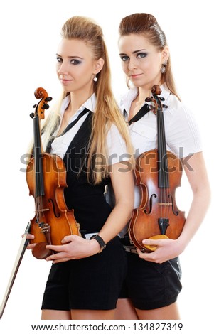 two beautiful young woman with violins isolated over white