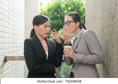 Two Beauty Asian Women Conversation About Office Rumor Gossip And Feel Shocked At Rest Time Outdoor Of The Company.
