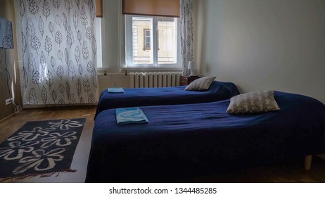 A two bedroom hostel inside the room it has blue cover with a very nice view