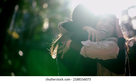 Two Best Friends Reunion. Female Friendship Hug And Embrace. Friends Hugging Girlfriend Outdoors In Sunlight. Real Life Love