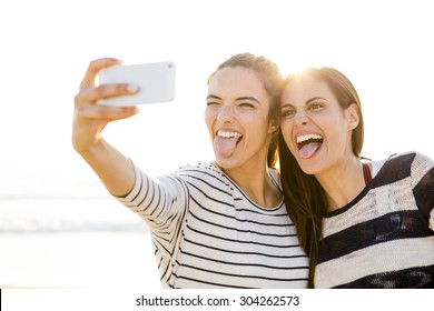 Two Best Friends Taking A Selfie With Cellphone