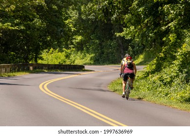 Two bicyclist riding along the Blue Ridge Parkway in North Carolina