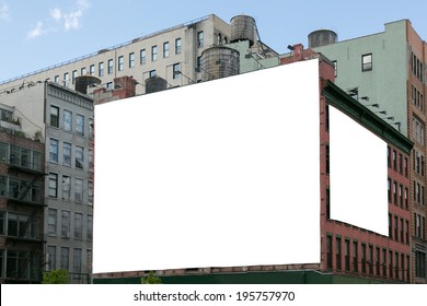 Two Big, White, Blank, Billboard On The Red Brick Building. On The Roof Visible Water Wooden Tank.