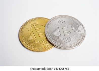 Two Bitcoin On White Background. Digital Cyber Safety Or Security Encryption. Manage Bitcoin Price Schedule Concept. Money Laundering Bitcoin Concept. Market Manipulation.