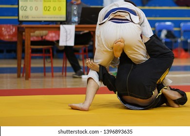 Two BJJ Brazilian Jiujitsu Fighters At The Tournament Fighting Jiu Jitsu Single X Guard