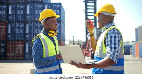 Two black African engineer using laptop control checking container from cargo freight for import and export , support logistics transportation concept