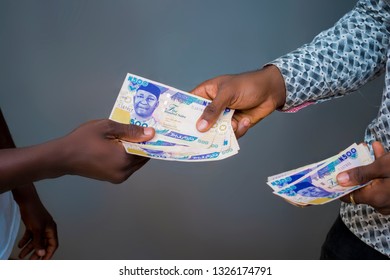 two black African having money transaction 
