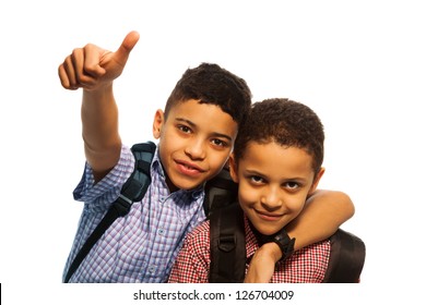 Two Black Boys After School With Thumbs Up And Hugging Each Other