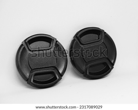 Two black camera lens caps with a diameter of 52mm, designed to provide good protection for the camera front glass from dust, scratches and accidental damage.