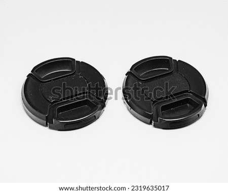 Two black camera lens caps with a diameter of 52mm, designed to provide good protection for the camera front glass from dust, scratches and accidental damage.