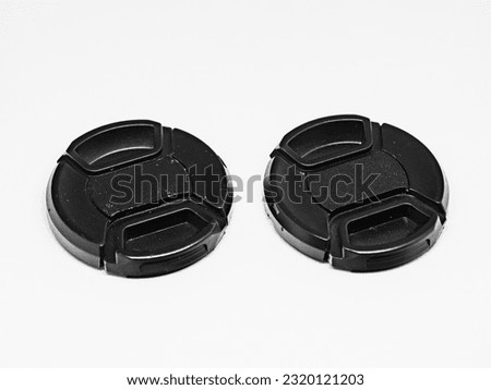 Two black camera lens caps with a diameter of 52mm, designed to provide good protection for the camera front glass from dust, scratches and accidental damage.