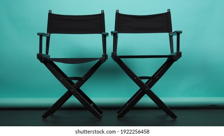 Two Black director chair on green or Tiffany Blue or mint background.it use in videography or film cinema industry