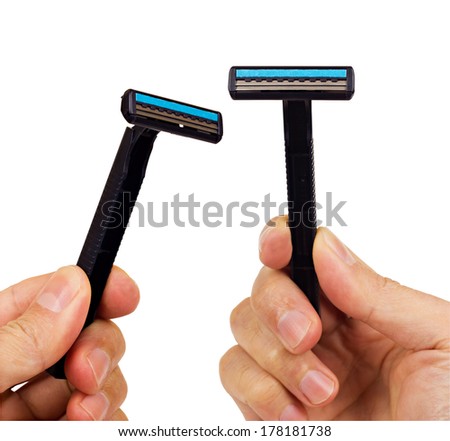Two black disposable blade shavers in male hands isolated on white