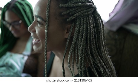 Two black female friends with box braids hairstyle. Young latina women with braided hair