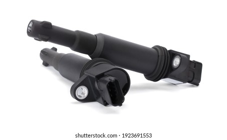 Two black ignition coils (or spark coil) of ignition system of gasoline engine isolated on white background. Spare part of the car. Car service concept.