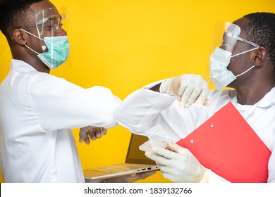 Two Black Lab Scientists Greet By Touching Their Elbows