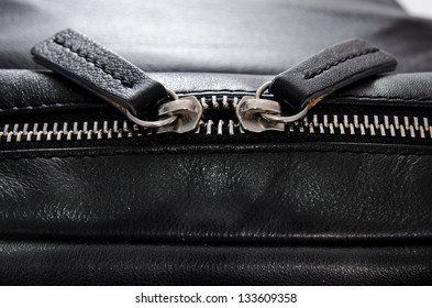 Two Black Leather Zipper Closeup