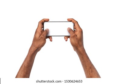 Two Black Male Hands Holding Smartphone With Blank Screen And Playing Games, Isolated On White Background, Mockup