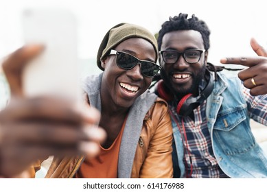 Two Black Race Friends Having Fun With Mobile. Friends Concept