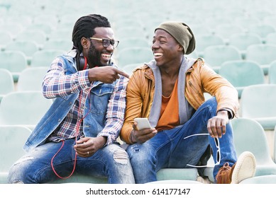 Two Black Race Friends Having Fun With Mobile. Friends Concept