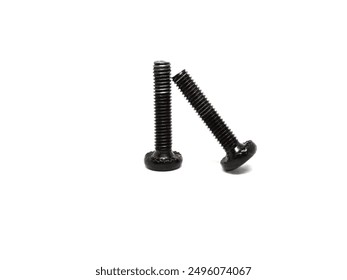 two black socket head cap screws in reverse position and one bolt positioned leaning, on white background photo isolated from side angle