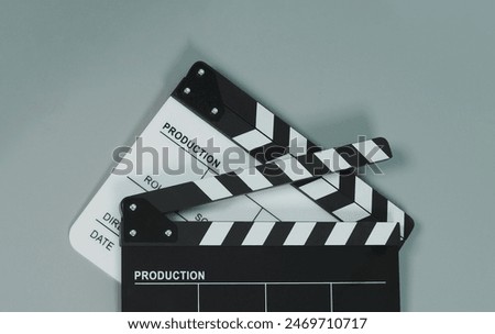 Two Black and white Clapper board on gray background.	