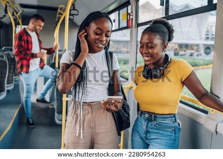 Similar – Image, Stock Photo black women friends using smartphone having fun in the city