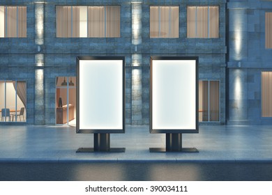 Two Blank Ad Banners At Night With Concrete Building In The Background, Mock Up, 3D Render