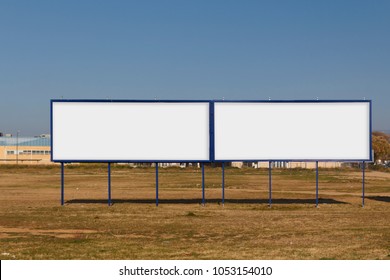 Two Blank Billboard Mock Up In An Urban Parcel