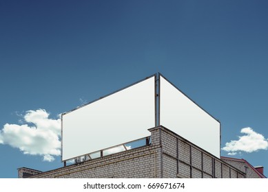 Two Blank Billboard On The Background Of Cloudy Sky