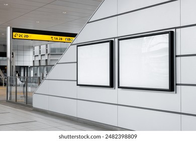 Two blank billboard posters down an escalator in an empty train station in Tokyo. Ideal for advertising and mockup