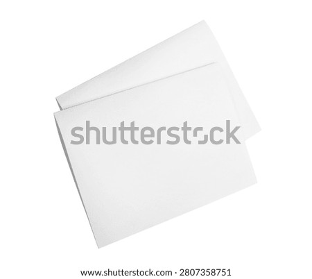 Two blank folded paper sheets, isolated on white background