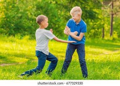 Two Blond Boys Fighting Park On Stock Photo (Edit Now) 746713021