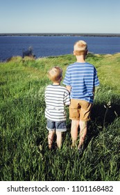 Two Blond Boys Looking Into The Distance. Conceptual Realism. Nature And People.