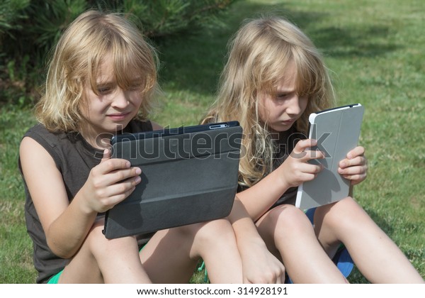 Two Blond Long Haired Boys Sitting Stock Photo Edit Now 314928191