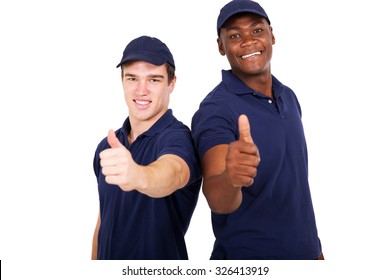 Two Blue Collar Co-workers Giving Thumbs Up