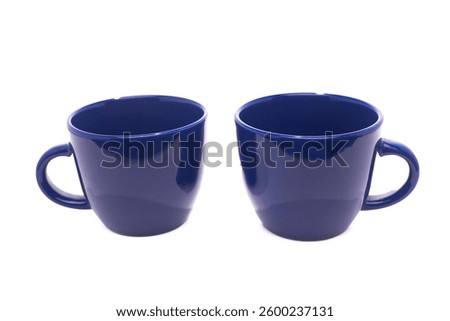 Two Blue empty coffee cups isolated on a white background.