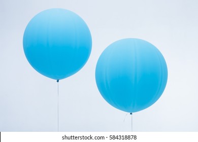 Two Blue Inflated Balloons 