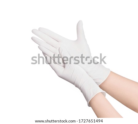 Two blue surgical medical gloves isolated on white background with hands. Rubber glove manufacturing, human hand is wearing a latex glove. Doctor or nurse putting on nitrile protective gloves
