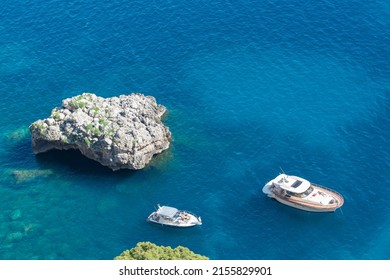 Two boats with holidaymakers off the coast of Capri.