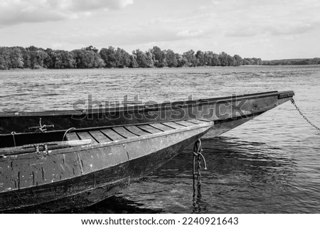 Two boats on the river. Black and white. Gennes-Val-de-Loire, Loira, Loire, Maine-et-Loire. France.