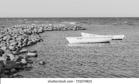 Two boats at the rocky pier by the sea. Freindship conceptual image. Black and white b&w shot. - Powered by Shutterstock