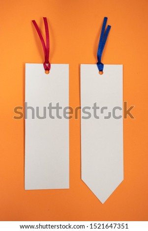 Two bookmarks on an orange background