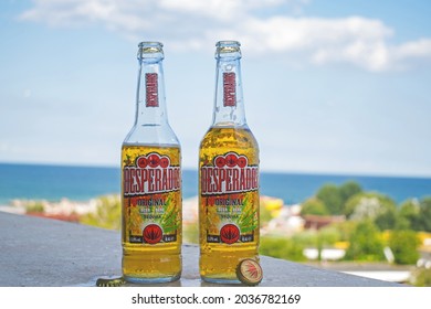 Two bottles of beer on the hotel terrace. Blue sea in the background. The beer is "Desperados" with a tequila aroma. Romania, Jupiter. August, 19, 2021