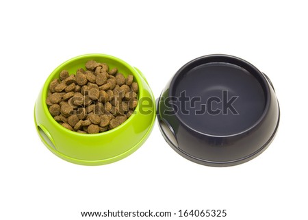 Two bowls with dry food & water for dog or cat isolated on white background