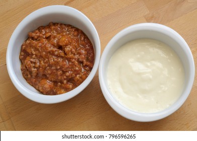 Two Bowls With Meat Sauce And BÅ½chamel Sauce, Ready To Fill A Tasty Lasagna