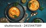 Two bowls of pumpkin soup. Pumpkin Autumn Healthy Food Nutrition Seasonal Vegetable Concept. Autumn vegetables. Top view.