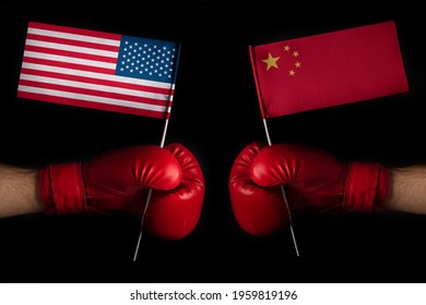 Two Boxer Hands With USA And China Flags. Superpower Confrontation Concept. Trade War Between The United States And China