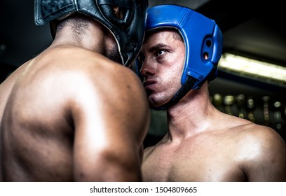 Two boxers training in the boxing gym. Amateur sparring. Concept about sport